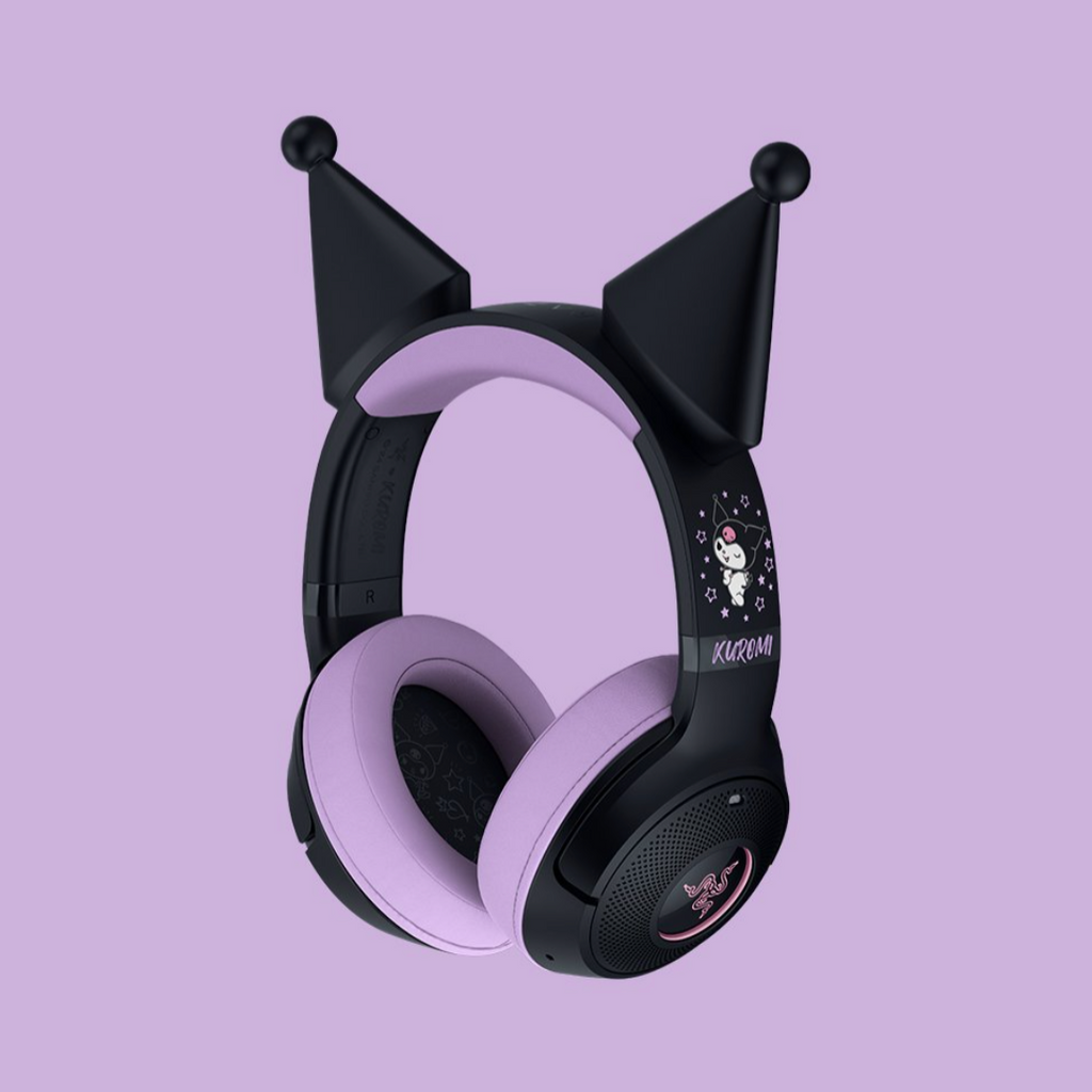 Black and purple gaming headset with cat ear attachments on a light purple background